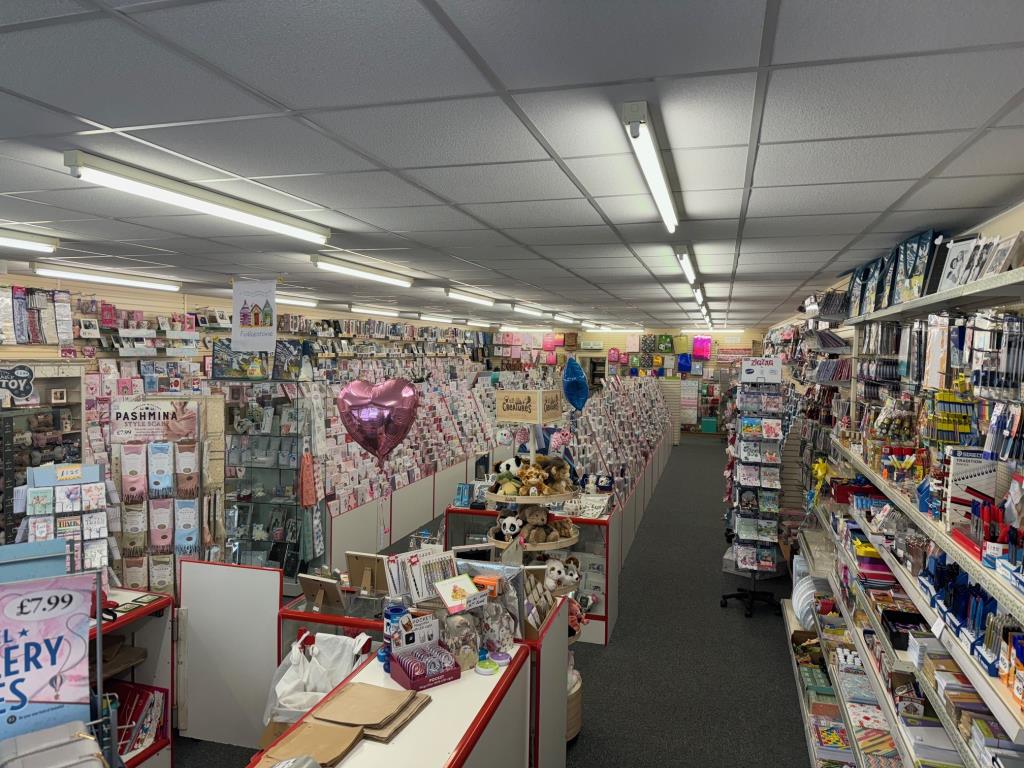 Lot: 169 - COMMERCIAL PREMISES AND A PAIR OF TWO- BEDROOM FLATS FOR INVESTMENT - Internal of shop from front looking towards the back